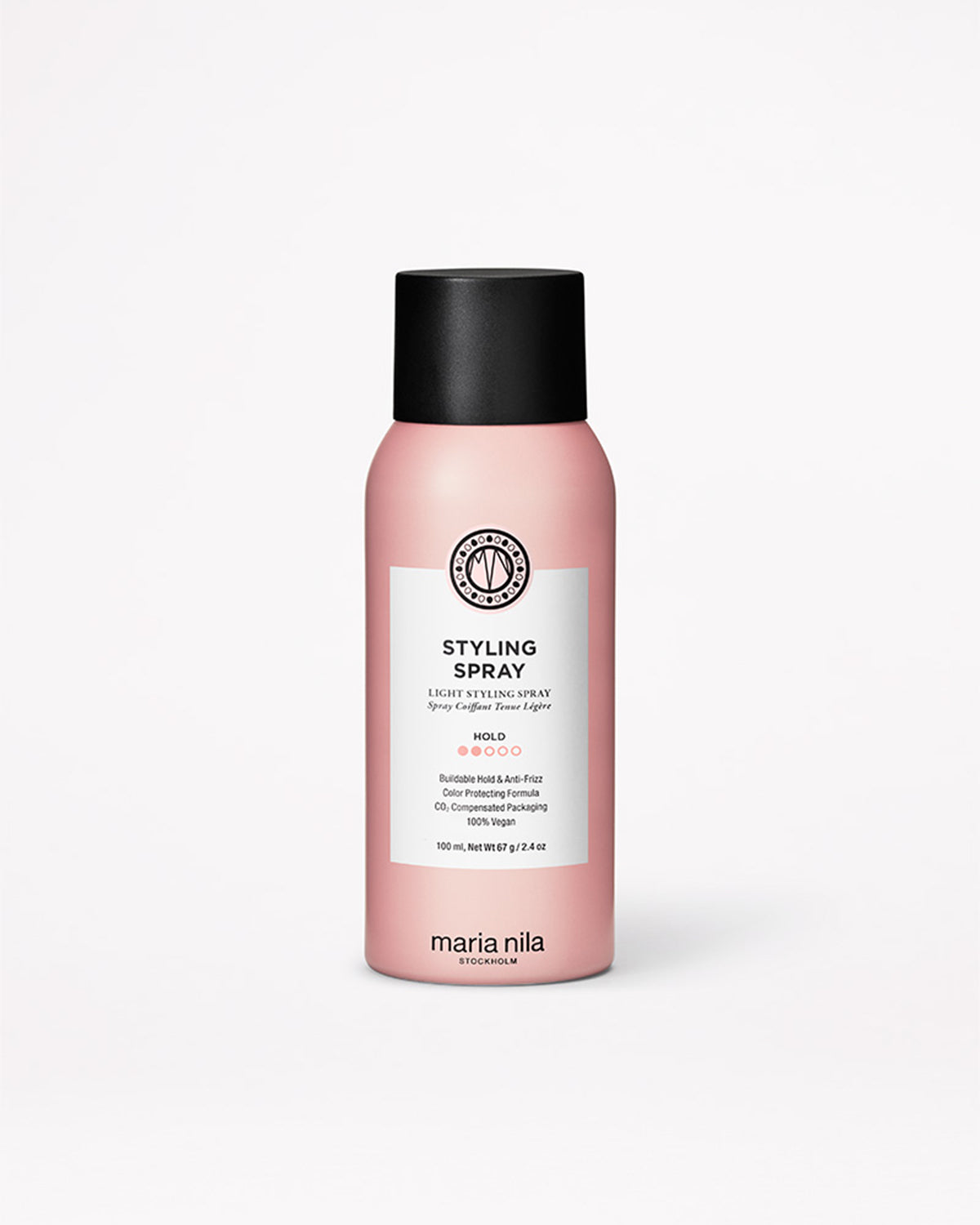 Pink bottle of Maria Nila styling spray on a white background