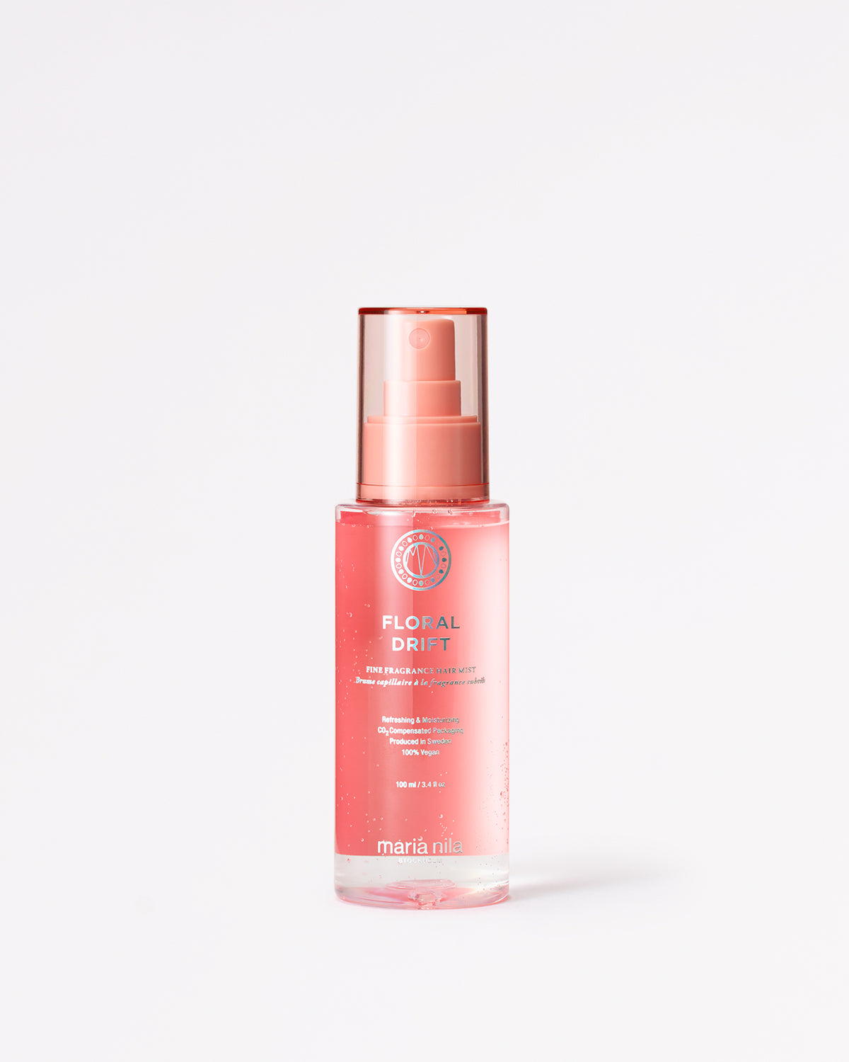 Pink bottle with Floral Drift hair mist on a white background