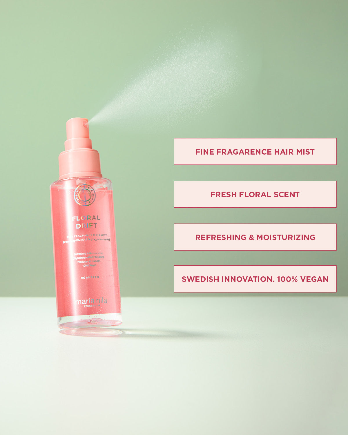 Pink hair mist bottle with product features on a light green background